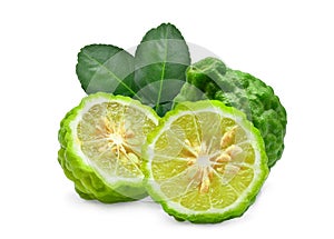 Whole and half fresh bergamot with green leaves isolated photo