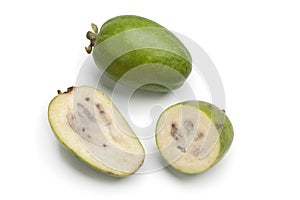 Whole and half fresh Feijoa fruit