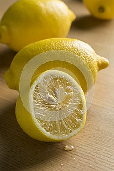 Whole and half fresh lemons