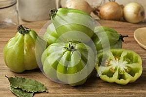 Whole and half gGreen Coeur de boeuf tomatoes