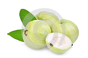 Whole and half guava fruit with green leaf isolated on white