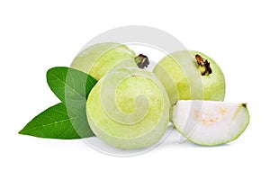 Whole and half guava fruit with green leaf isolated on white