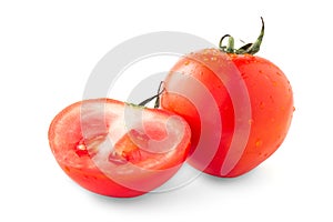 Whole and half red tomato with green leaf isolated on white background