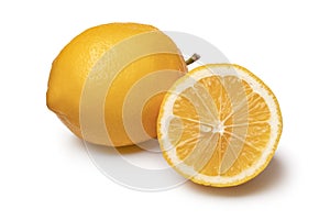 Whole and halved fresh Meyer lemon close up on white background photo