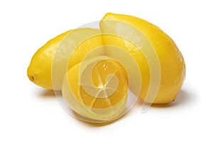 Whole and halved lemon snack on white background close up