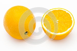Whole and halved oranges photo