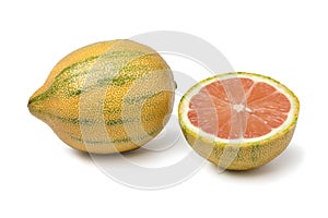 Whole and halved tiger lemon isolated on white background