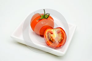 Whole and halved tomatoes