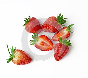 Whole and halves of fresh ripe red strawberries