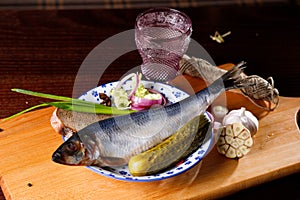 whole herring, onion rings, garlic, bread, vodka