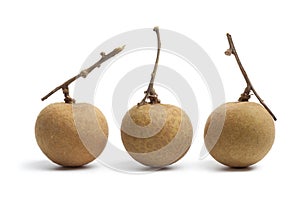 Whole longan fruit with stems