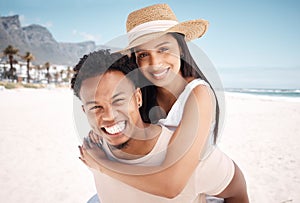 A whole lotta love. a young couple having fun at the beach together. photo