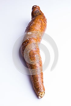 Whole manioc, cassava, on white background, closeup