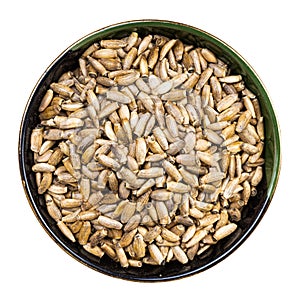 Whole milk thistle seeds in round bowl isolated