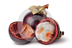 Whole and opened mangosteen with shells isolated on white