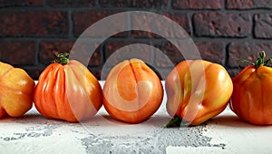 Whole organic tomatoes Coeur De Boeuf. Beefsteak tomato on white rustic table