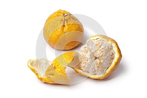 Whole and partial peeled ugli fruit