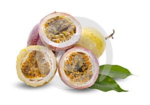 Whole passion fruits and a half with leaves isolated on white background