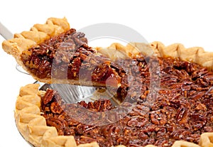 A whole pecan pie on white