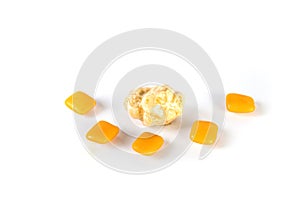 Whole pieces and chewed orange bubble gum isolated over white