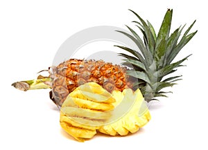 Whole pineapple peeled, sliced and reassembled. Isolated on white.