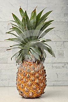 Whole Pineapple Standing Upright On Restaurant Counter, Bokeh Background