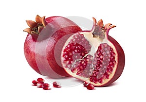 Whole pomegranate half seeds isolated on white