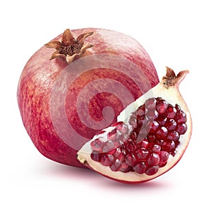 Whole pomegranate and quarter slice on white background