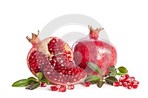 Whole Pomegranate and two parts of Pomegranate with leaves