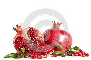 Whole Pomegranate and two parts of Pomegranate with leaves