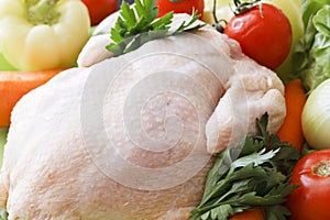 Whole raw chicken with vegetables