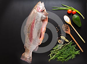 Whole raw filleted salmon trout with seasoning