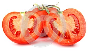 A whole red tomato cut into two halves is isolated on a white background