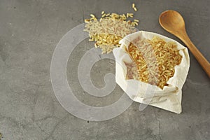 Whole rice heap. Wholegrain cereals for healthy food. Dark background