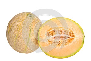 Whole ripe cantaloupe next to half cantaloupe cute lengthwise, showing seeds and connective fibers