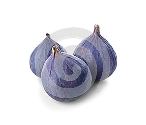 Whole ripe purple figs on white background