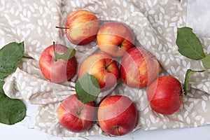 Whole ripe red apples on white table, flat lay