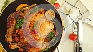 Whole roast chicken garlic, holiday food roasted glazed delicious on a wooden background slow-motion