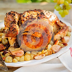 Whole Roast Chicken with Grapes, Garlic and Almonds