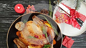 Whole roast chicken, holiday food roasted glazed delicious on a wooden background slow-motion