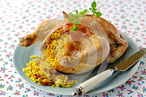 Whole Roast Chicken Stuffed with Curried Rice and Sultanas, selective focus