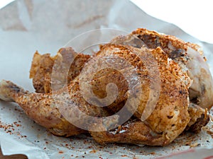 Whole roast grilled chicken on apaper