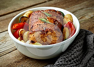 whole roast pork and vegetables