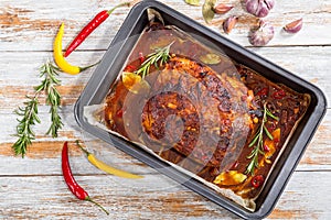 Whole roast shoulder of pulled pork in roasting pan