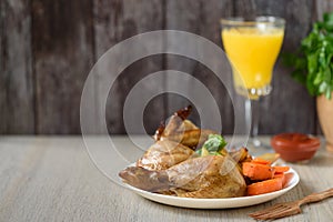 Whole roasted chicken with vegetables. Close up