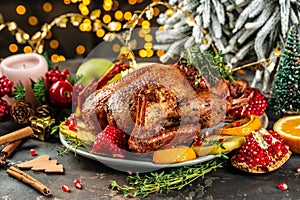Whole roasted duck with oranges, berries and herbs. Dish for Christmas Eve