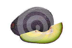 Whole and slice of avocado isolated on white