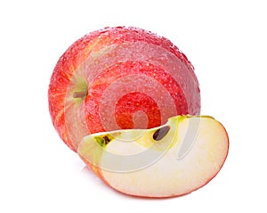 Whole and slice of fresh gala red apple with drop of water