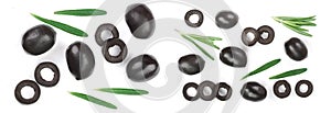 whole and sliced black olives with rosemary leaves isolated on white background. Top view. Flat lay pattern