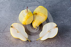 Whole and sliced Corella pears